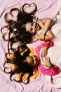 Pajama party and childhood concept. Schoolgirls in pink pajamas Royalty Free Stock Photo