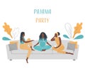 Pajama party. Three young black women in pajamas are sitting on the couch and talking Royalty Free Stock Photo