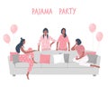 Pajama party. Slumber party. Young women in pajamas are sitting on the couch and talking. Some women are standing near the sofa