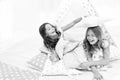 Pajamas party for kids. Girls having fun tipi house. Girlish leisure. Sisters share gossips having fun at home. Cozy Royalty Free Stock Photo