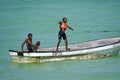 Paje, Zanzibar - October 2024: local children jumping from a boat