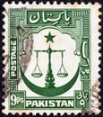 PAKISTAN - CIRCA 1948: A stamp printed in Pakistan shows Scales of Justice with crescent moon, circa 1948.