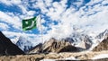 Pakistan flag with K2 and Broad Peak mountains in the background