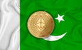 Pakistan flag ethereum gold coin on flag background. The concept of blockchain bitcoin currency decentralization in the country