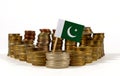 Pakistan flag with stack of money coins Royalty Free Stock Photo