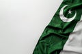 Pakistani Flag, Green and White Fabric with Crescent Moon and Star, Soft Lighting, Folded Royalty Free Stock Photo