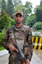 Pakistani infantry soldier stands at guard in the Swat Valley, Pakistan.