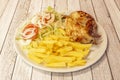 Pakistani restaurant menu with half roast chicken, french fries and salad