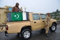 Pakistani soldiers prepare for patrol on pick-up: