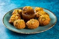 Pakistani spicy gol gappay, indian pani puri and bangali fuchka full of chaat masala with sour water in a dish isolated on marble