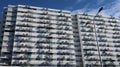 Large apartment building soars into blue sky