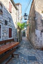 Narrow, old, stone paved streets and houses of dalmatian town by the Adriatic sea