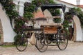 Pakruojis Manor Park. An ancient four-wheeled motor carriage to the wall