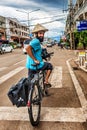 The man travelling on the bicycle in Pakse, Laos.