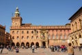 Palace of Accursio in Piazza Maggiore of Bologna with tourists o Royalty Free Stock Photo