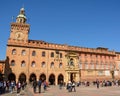 Palace of Accursio in Piazza Maggiore of Bologna with tourists o Royalty Free Stock Photo