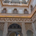 Palace of Alcazar, Famous Andalusian Architecture. Old Arab Palace in Seville, Spain. Ornamented Arch and Column Royalty Free Stock Photo