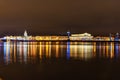 Palace Bridge and Vasilyevsky island Spit Strelka with Rostral columns at night. Saint Petersburg, Russia Royalty Free Stock Photo