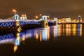 Palace Bridge and Vasilyevsky island Spit Strelka with Rostral columns at night. Saint Petersburg, Russia Royalty Free Stock Photo