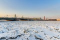 Palace Bridge and Vasilyevsky island Spit Strelka with Rostral columns in winter. Saint Petersburg, Russia Royalty Free Stock Photo