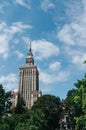 Palace of Culture and Science in Warsaw, Poland. Skyscraper, symbol of communism and stalinism on blue sky, clouds background.