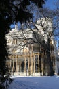 Palace Hluboka with terrace behind tree during winter