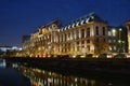 Palace of Justice in Bucharest, Romania, at night, near Dambovita river with rush hour traffic. Court, justice, law. Royalty Free Stock Photo