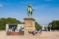 The Palace Square, equestrian statue of King Carl Johan in front of the Royal Palace in Oslo and poster of the Royal Family