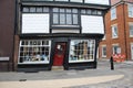 A very old house bulging out over the road to see who was passing by 1849 by Royalty Free Stock Photo