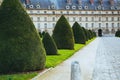 Palace of Versailles seen through a garden Royalty Free Stock Photo