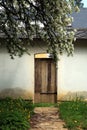 A palace wall with a wooden gate. Entrance to the farm part of the palace.