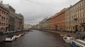 Palaces on the river with boats in Saint-Petersburg