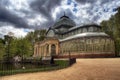 Palacio de cristal with dramatic clouds