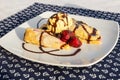 Palacsinta, traditional Hungarian sweet pancakes served with fruit and a scoop of ice cream, Delicious dessert Royalty Free Stock Photo