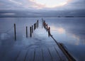 Palafitic pier submerged at sunset