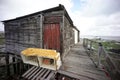 palafitico pier built in a disorganized and rustic way. recycled building materials