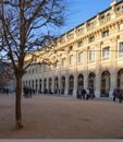 Palais royal in Paris at sunset with the sun hitting the top of the building Royalty Free Stock Photo