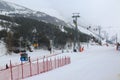 Skilifts and paladoken ski center at ejder hill during misty weather in Palandoken mountain, Erzurum, Turkey