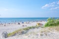 Palanga, Lithuania - Aug 03: People are relaxing on sandy beach of the Baltic sea. Seaside resort at warm summer day on Baltic sea