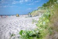 Palanga, Lithuania - Aug 03: People are relaxing on sandy beach of the Baltic sea. Seaside resort at warm summer day on Baltic sea