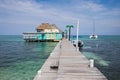 A palapa bar at the end of a dock in Belize