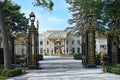 Palatial mansion with gilded gates