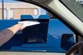 Palatine, IL/USA - 08-27-2020: A woman is safely mailing in her application for ballot for 2020 election at a drive up mailbox at