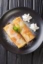 Palatschinken Austrian crepes with apricot jam close-up in a plate. vertical top view Royalty Free Stock Photo