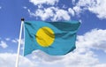 Palau Flag mockup, fluttering under a blue sky