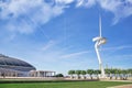 Palau Sant Jordi sportive building next to Telefonica Telecom Antenna against a blue sky. Empty copy space