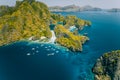 Palawan, Philippines aerial view of tropical Miniloc island. Tourism trip boats at big lagoon entrance. Natural scenery Royalty Free Stock Photo