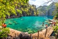 People tourists swimming at Kayangan Lake in Coron Island, Palawan, The Philippines. Royalty Free Stock Photo