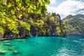 People tourists swimming at Kayangan Lake in Coron Island, Palawan, The Philippines. Royalty Free Stock Photo