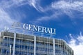 Palazzo with Assicurazioni Generali sign in Milan. The blue sky is the background of the Italian insurance company